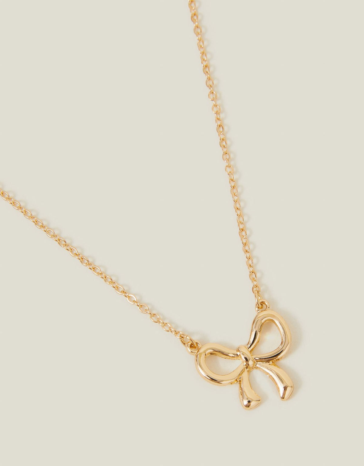Stainless Steel Bow Pendant Necklace – Gold Tone