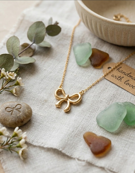 Stainless Steel Bow Pendant Necklace – Gold Tone
